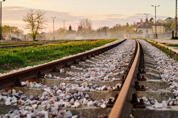New railway rails on sleepers at a freight railway station