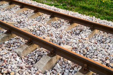 Naklejka premium New railway rails on sleepers at a freight railway station
