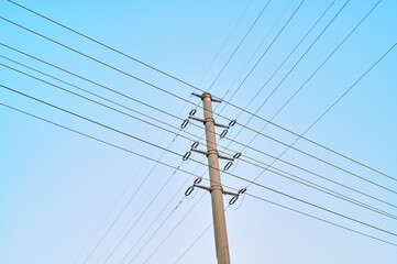 Crossing high-voltage wires against the sky