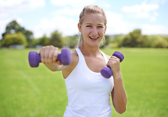 Sunshine and exercise. a group of young women exercising outdoors.