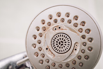 Shower tap covered in rust and calx layer. Unsanitary conditions in shower concept, bad quality and hard water, toned photo