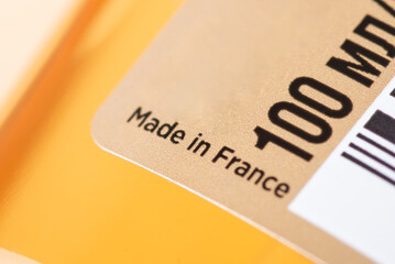 Bottle of hair oil 100 ml volume with inscription Made in France. Close up of the country the cosmetics was produced in, manufacturing goods in France concept