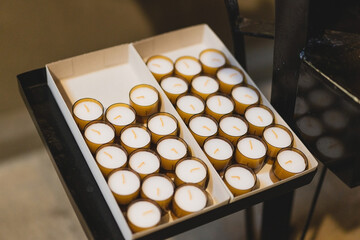 Many Candles in a cathedral. Religious ritual in the church. Concept for faith, spirituality and religion.