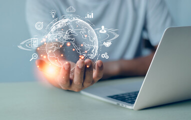 Businessman holding virtual Global Internet connection metaverse. Financial and banking, Digital link tech, big data.Business global internet connection application technology and digital marketing..