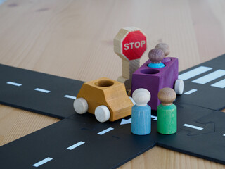 Car accident concept of vehicle insurance. two mini wooden toy cars on the road, incident, car...