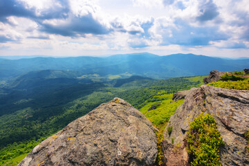 mountainous countryside scenery in summer. steep grassy slopes with stones. popular travel destination of ukrainian carpathians