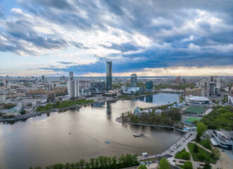 Fototapeta na wymiar Yekaterinburg city and pond aerial panoramic view at summer sunset.