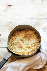 Seafood cous cous with carrots, onions and parsley