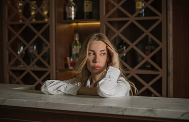 Portrait of pretty woman in a bar or club, concept of drinks, beverage 