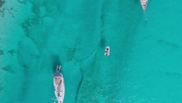 Aerial Top Down Drone View of Bahamas Crystal Water with Snorkelers and Dingy