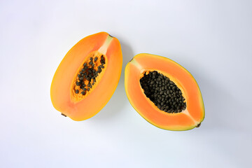 Top view fresh sliced papaya fruits isolated on white background. Created with Generative AI Technology