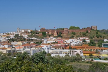 Fototapeta na wymiar Silves, Portugal - April 11, 2023: The Castle of Silves is one of the best preserved Moorish fortifications in Portugal resulting in its classification as a National Monument in 1910. Selective focus