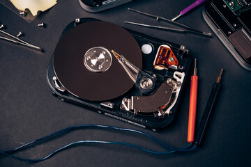 Computer disassembled HDD hard drive data disc SSD, backup part of PC or laptop. Recovery, fixing...