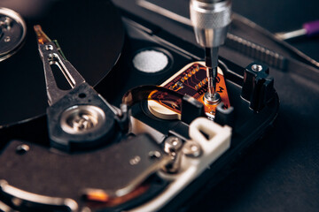 Computer service engineer technician workplace repairing fixing disassembled HDD hard drive data...