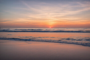 Fototapeta na wymiar Sunset on the beach and sea waves, Generative AI