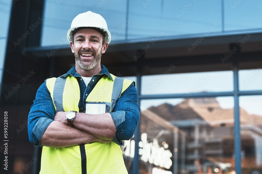 Poster hell get the job done. a engineer standing in front of a building.