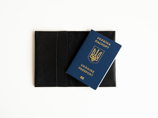 Ukrainian biometric passport id on a leather passport cover to travel the Europe without visas on...