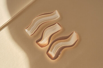 Foundation swatch with spf on a beige.