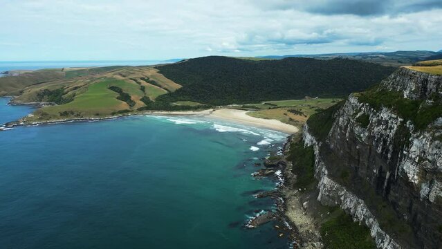 Aerial shot of a beach in Purakaunui Bay, a beautiful landscape in Catlins coastal area | Otago, New Zealand