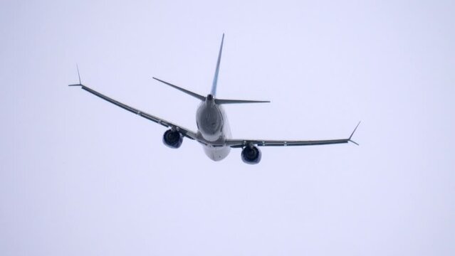 Passenger Airplane Departure, Low Angle, Overcast Sky Background.