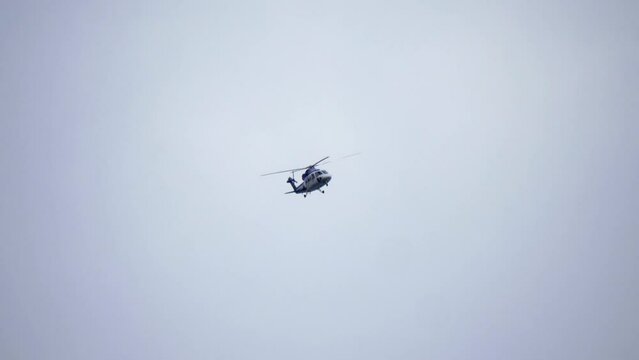 Helicopter Flying in the Distance, Overcast Sky Background 4K