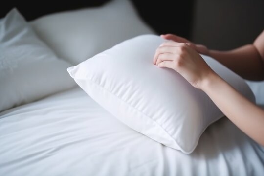 hand holding a pillow