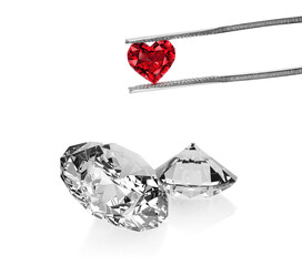 Excellent red heart cut diamonds held by tweezers and dazzling diamond on white background