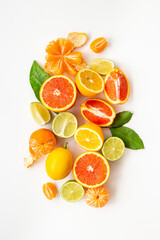Mixed fruits background layout - many citrus slices top view.