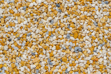 Tiny gravel texture on brown concrete wall. Texture background seamless gravel floor.