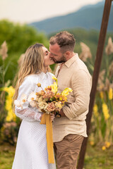 beauty and happiness of a young, gorgeous couple in candid moments of tenderness. They are deeply...