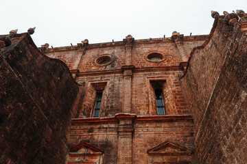 Closeup shot of windows of the Basilica of Bom Jesus monument in Goa, India. Ancient church built by Portuguese at Panaji in North Goa. UNESCO world heritage site of Goa.	