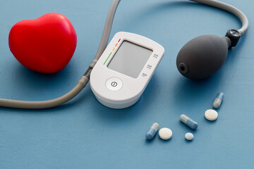 Red heart and blood pressure monitor. Heart diseases diagnosis concept