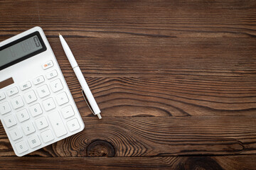 Business accounter working with calculator for taxes accounting