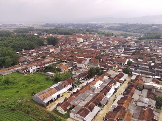 Aerial Photography. Bird's eye view of public housing in the valley of Mount Pangradinan. Location place in Cikancung, on the outskirts of Bandung Region - Indonesia