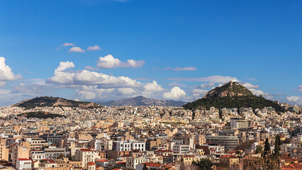 Fototapeta premium Panorama of Athens, view of Lycabettus mount from Acropolis foot, Greece. Skyline of Athens city center. Cityscape of historical town of Athens with old and modern Greek houses. Travel concept