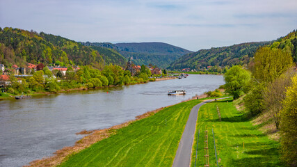 Obraz premium Bad Schandau, Saxony, Germany. Panoramic view of the national park Saxon Switzerland by Dresden and Elbe river with a ferry boat