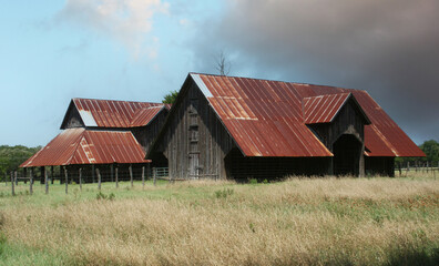 Fototapeta na wymiar Historic Barns on rural farm in East Texas