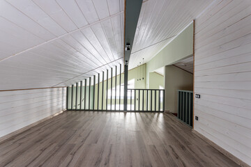 empty room without furniture in green tones in the attic