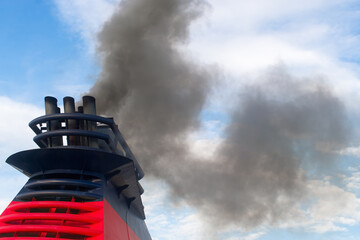 Polluting smoke comes out of the smokestacks of a large ship