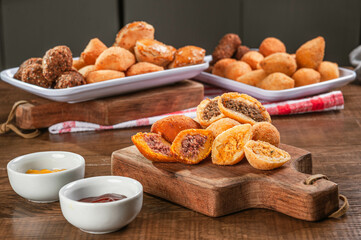 Various brazilian snacks deep fried. (Coxinha, kibe, empadinha e risolis).