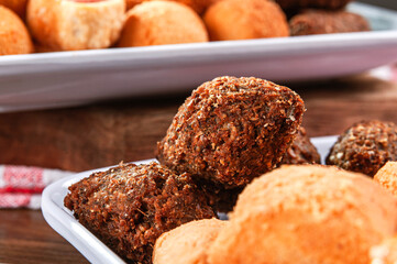 Various brazilian snacks deep fried. (Coxinha, kibe, empadinha e risolis).