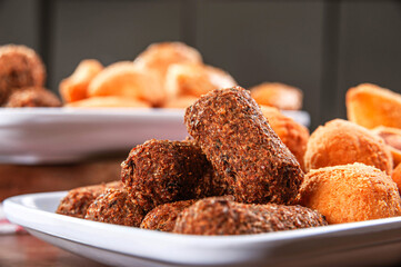 Various brazilian snacks deep fried. (Coxinha, kibe, empadinha e risolis).