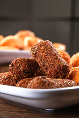 Various brazilian snacks deep fried. (Coxinha, kibe, empadinha e risolis).