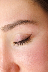 Fototapeta na wymiar macro photo performing eyelid tattooing. Permanent make-up of the eyelids, eyelash tattooing.