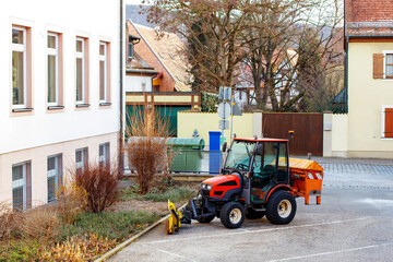 Tractor parked near buildings in the city