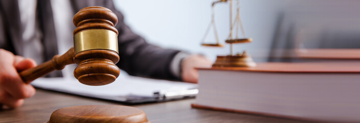 A man holds papers and hits the court.