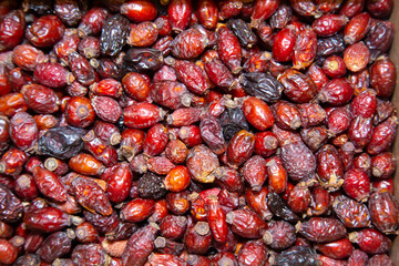 Rosehip fruits are dried brown in color with a beautiful pattern. Fruits nuts vegetables berries useful products agriculture agriculture.