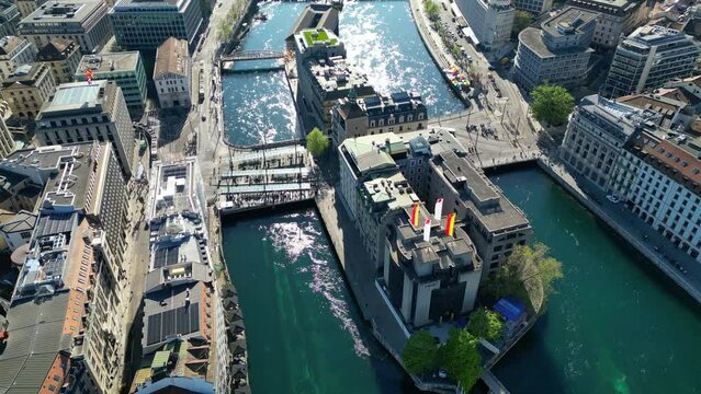 Aerial video of Geneva, Geneva city view to the lake. Taken above the old town. Down the River Rhone 4K