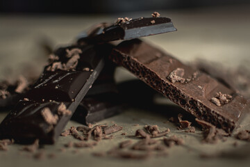 several types of chocolate bars on a light background