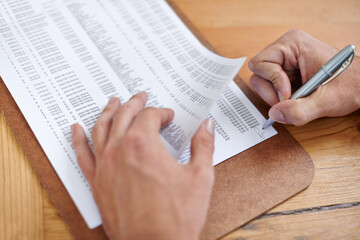 These documents need his initials. Cropped image of a businessmans hands initialing some paperwork.